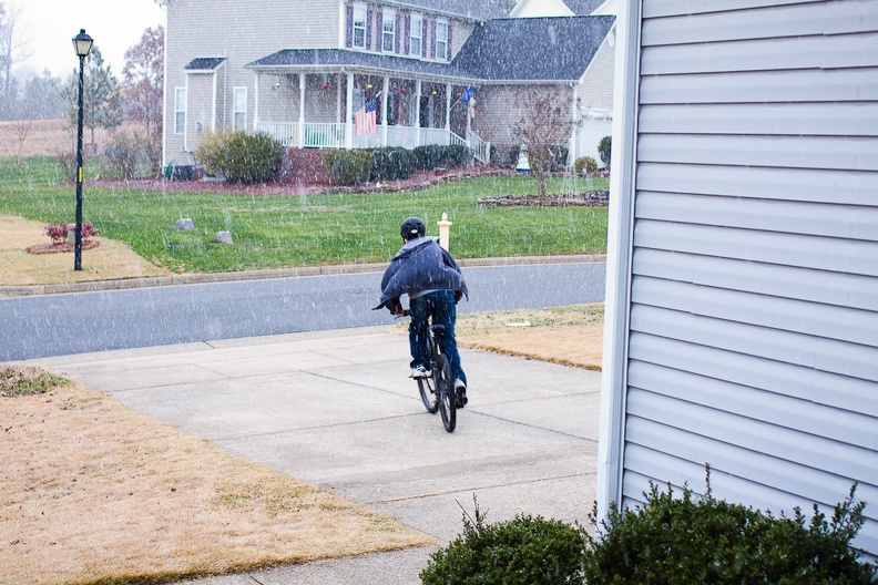 Joseph just HAD to test out the snow with bike